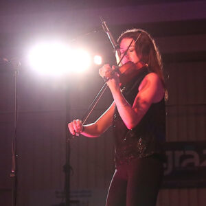 Photo of Mika McCairley-Greenwell, playing a violin